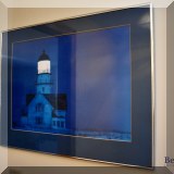 A56. Framed lighthouse print.